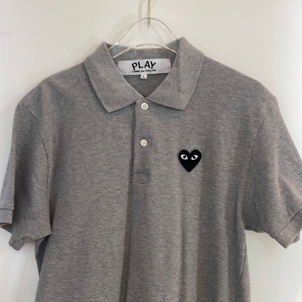 SOLD COMME DES GARCONS Gray Classic Polo heart patch at the chest.